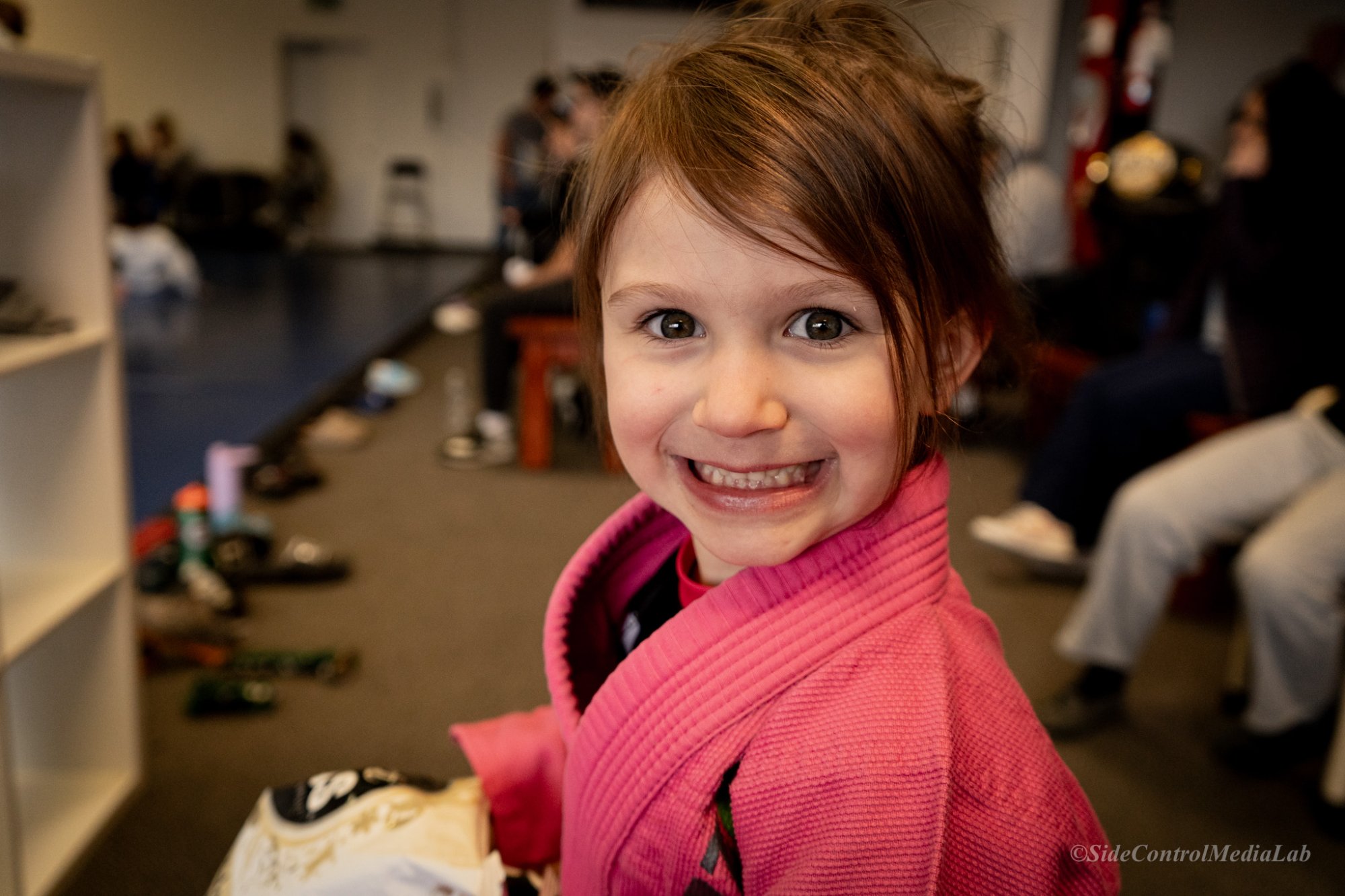 Young girl in pink gi