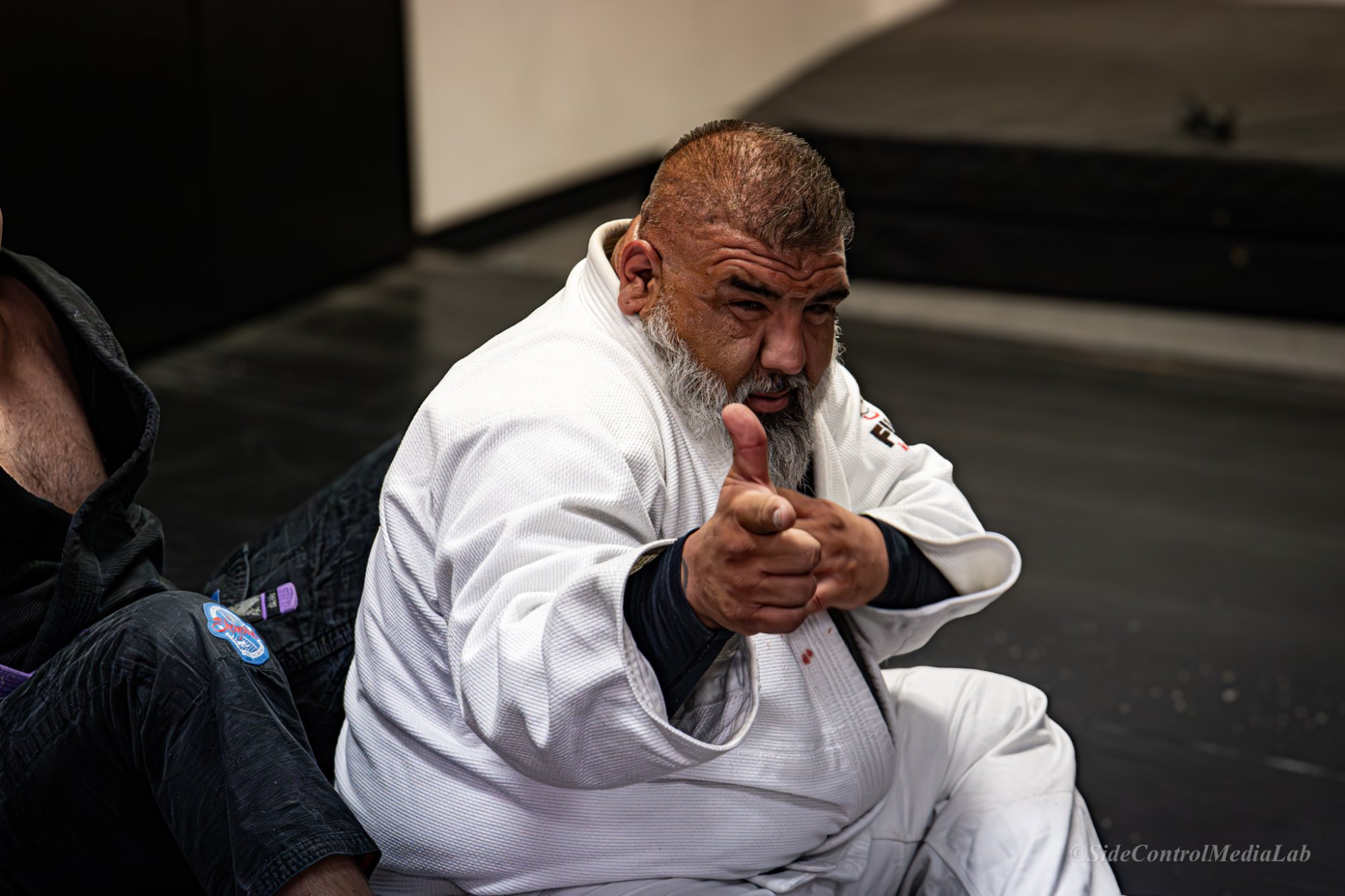 Coach on the mat
